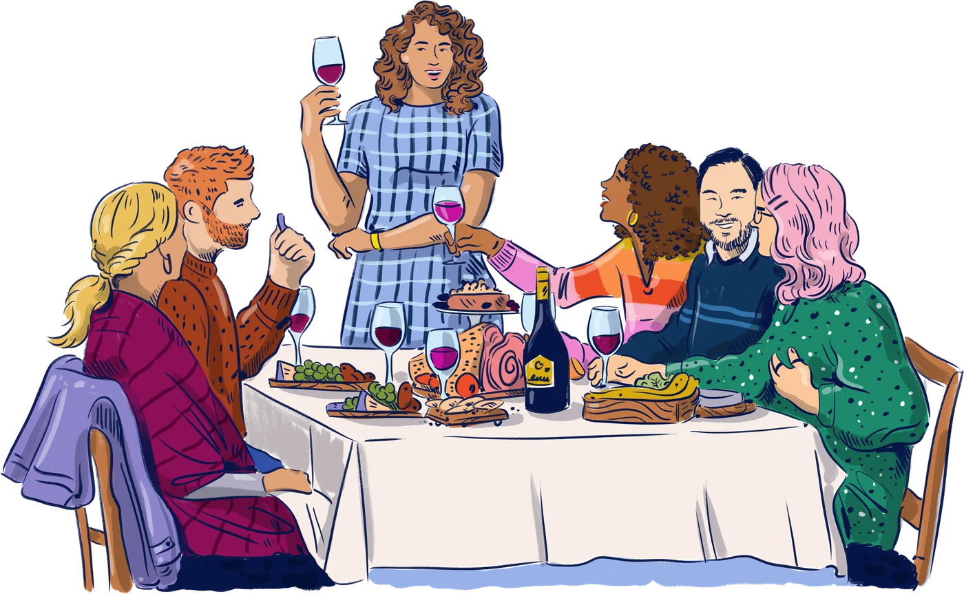 Friends toasting with wine around a dinner table